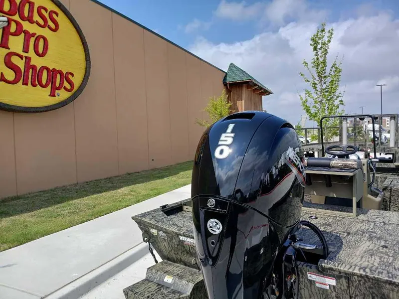 Slide: The Image of 2025 Tracker Grizzly 2072 CC Sportsman boat at Bass Pro Shops, featuring a 150 HP engine. - 9