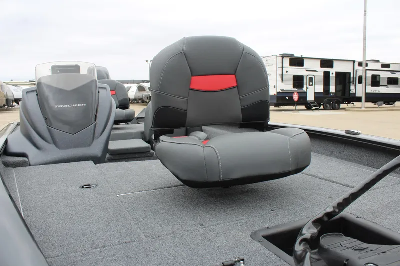 Slide: The Image of 2025 Tracker Pro Team 175 boat interior with gray and red seating. - 10