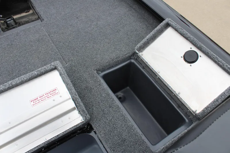 Slide: The Image of 2025 Tracker Pro Team 175 boat storage compartments with carpeted finish. - 13