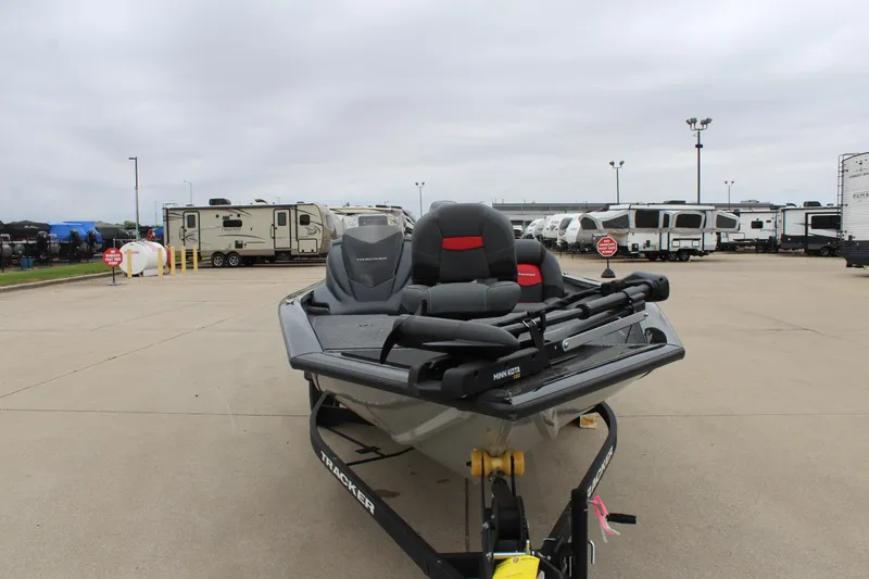 Slide: The Image of 2025 Tracker Pro Team 175 boat in a parking lot with RVs in the background. - 2