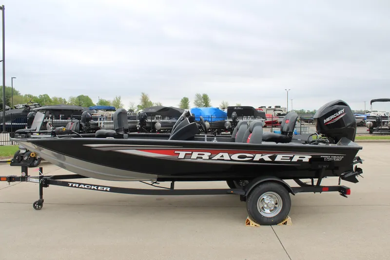 Slide: The Image of 2025 Tracker Pro Team 175 boat on trailer, side view, outdoors. - 4