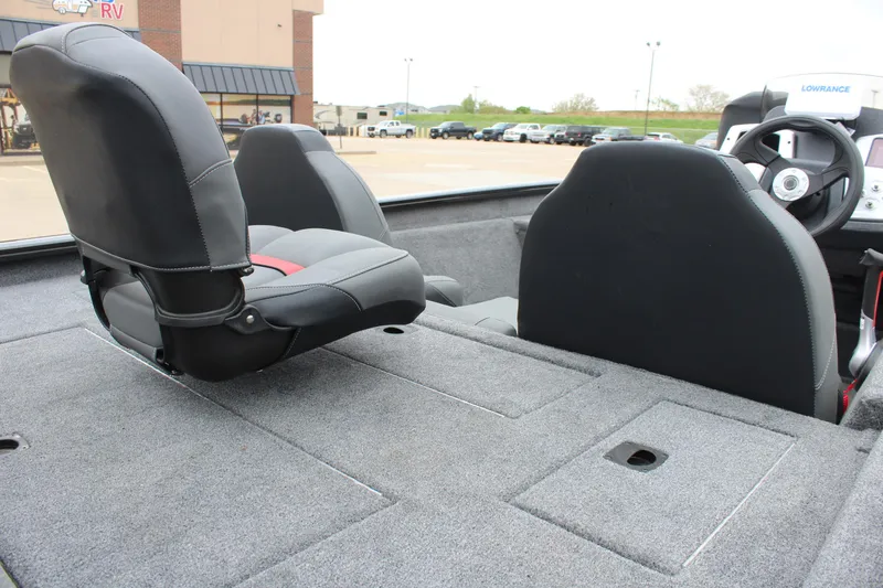 Slide: The Image of 2025 Tracker Pro Team 175 boat interior with seating and carpeted deck. - 7