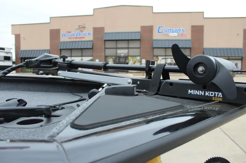 Slide: The Image of 2025 Tracker Pro Team 175 boat with Minn Kota Edge trolling motor in front of dealership. - 9