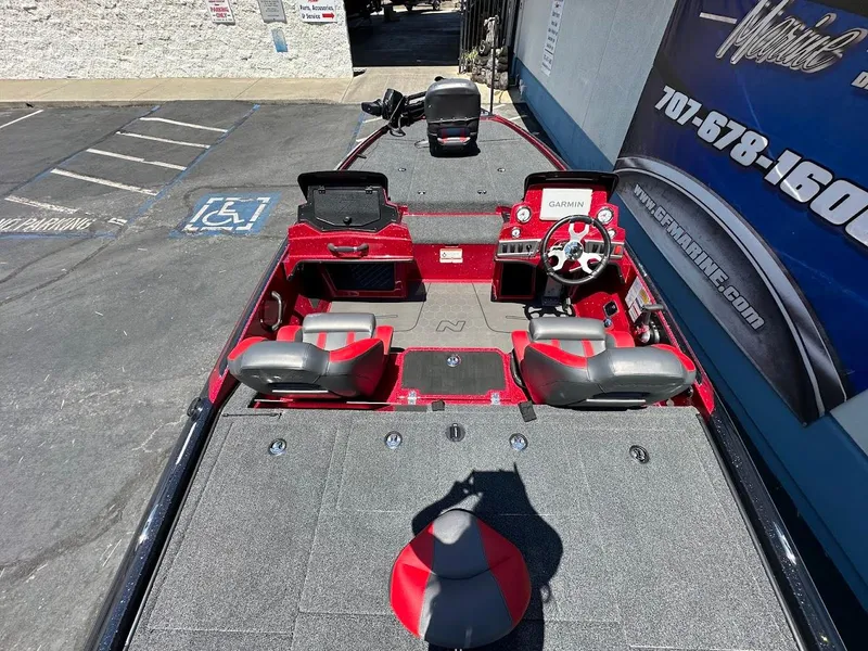 Slide: The Image of 2025 Nitro Z19 Pro boat interior with red and gray seating, steering wheel, and Garmin display. - 10