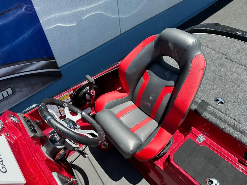 Slide: The Image of Red and gray seat in 2025 Nitro Z19 Pro boat cockpit, featuring steering wheel and controls. - 15