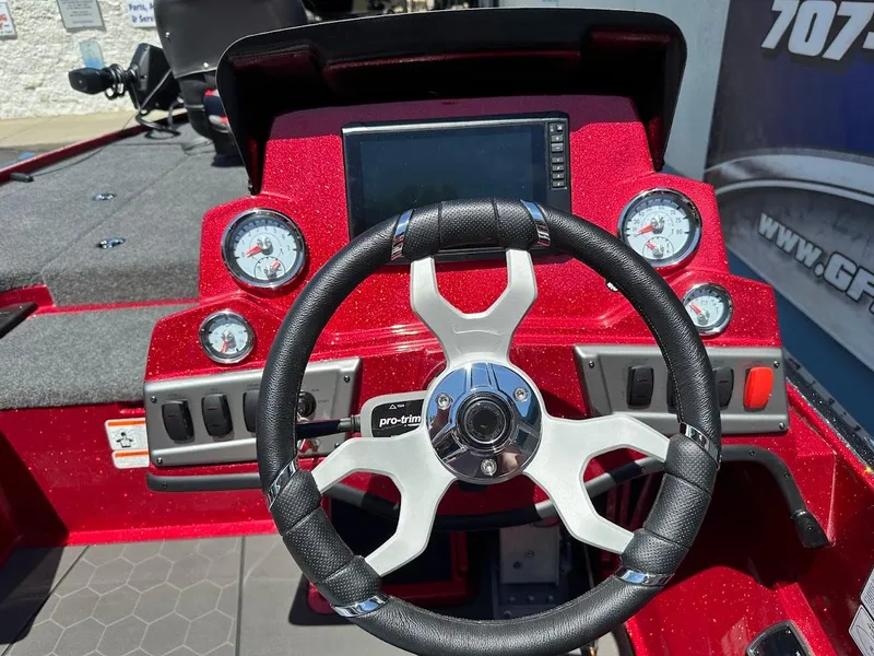 Slide: The Image of Steering console of a 2025 Nitro Z19 Pro boat with gauges and controls. - 16