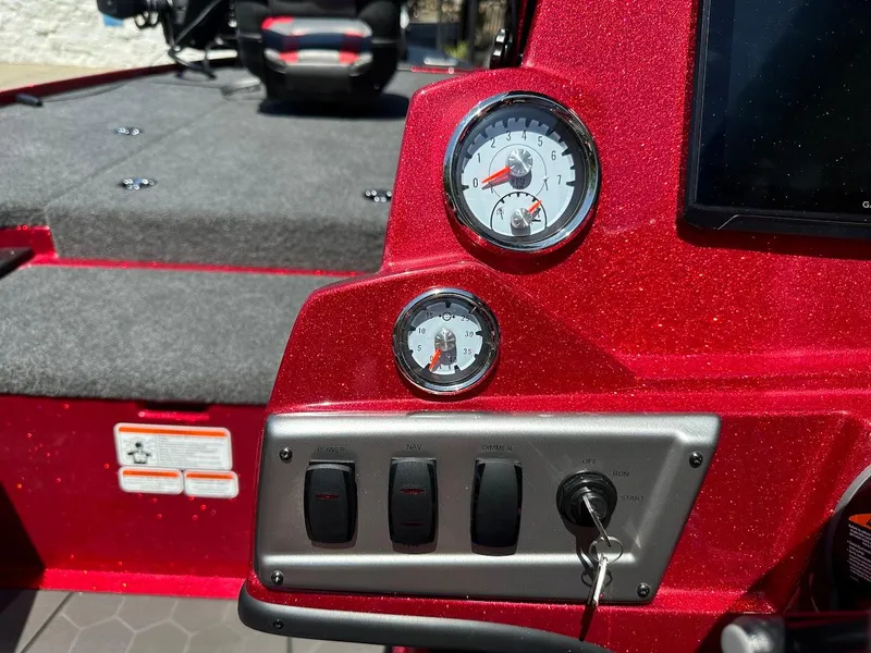Slide: The Image of Red dashboard of 2025 Nitro Z19 Pro boat with gauges and switches. - 18