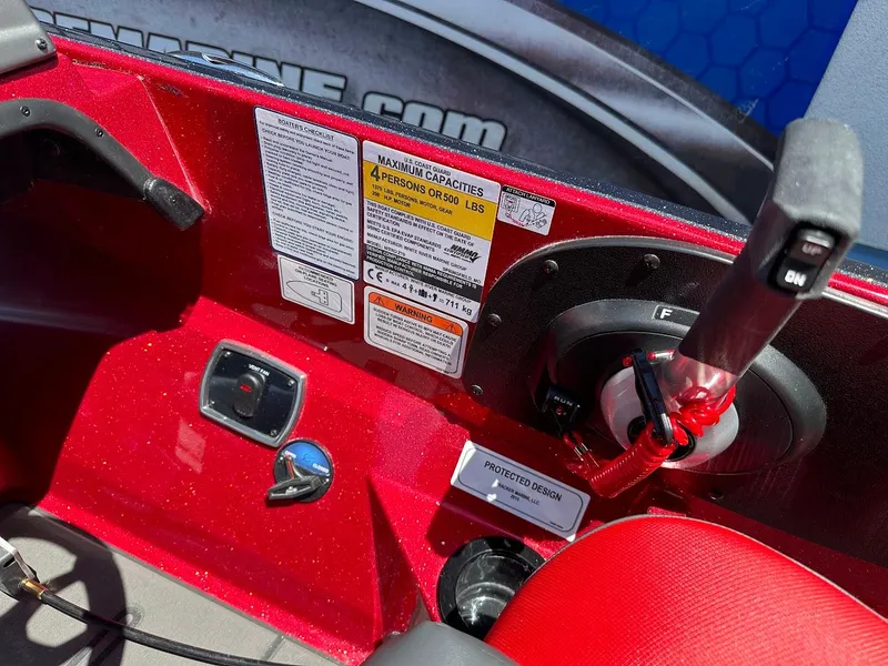 Slide: The Image of Red Nitro Z19 Pro 2025 boat dashboard with controls and capacity labels. - 20