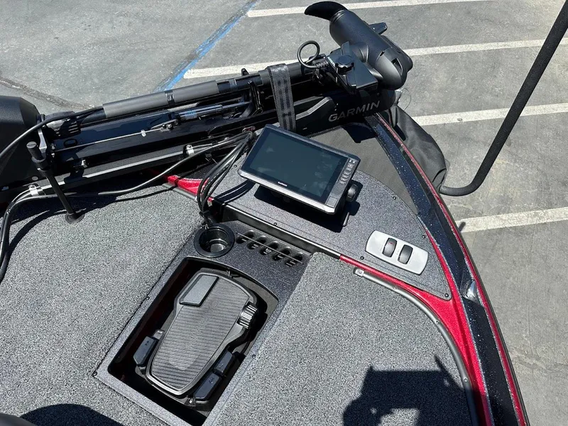 Slide: The Image of 2025 Nitro Z19 Pro boat dashboard with Garmin device and foot pedal controls. - 25