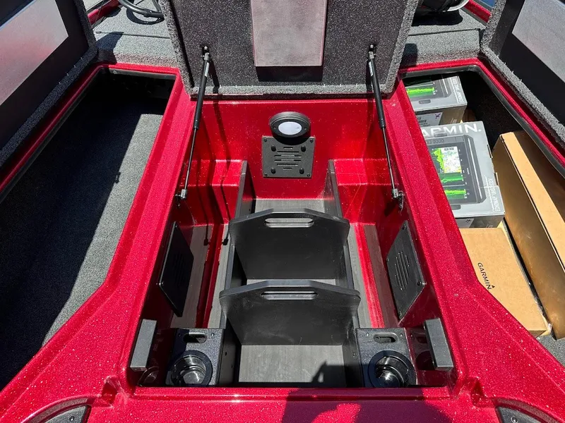 Slide: The Image of 2025 Nitro Z19 Pro boat storage compartment with Garmin electronics boxes. - 29