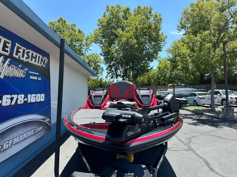 Slide: The Image of 2025 Nitro Z19 Pro boat parked outside a marine shop on a sunny day. - 3