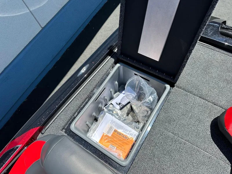 Slide: The Image of Storage compartment of 2025 Nitro Z19 Pro boat, containing various items. - 32