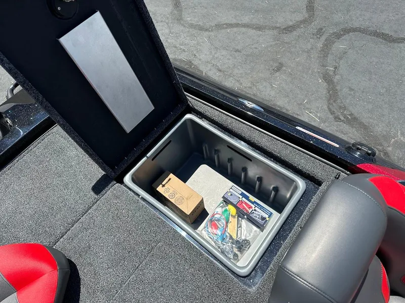 Slide: The Image of Open storage compartment in 2025 Nitro Z19 Pro boat with accessories inside. - 33