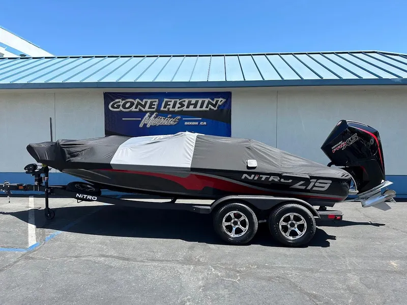 Slide: The Image of 2025 Nitro Z19 Pro boat on trailer, covered, parked outside a building. - 34