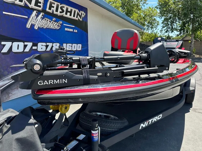 Slide: The Image of 2025 Nitro Z19 Pro boat with Garmin equipment, displayed outdoors. - 4