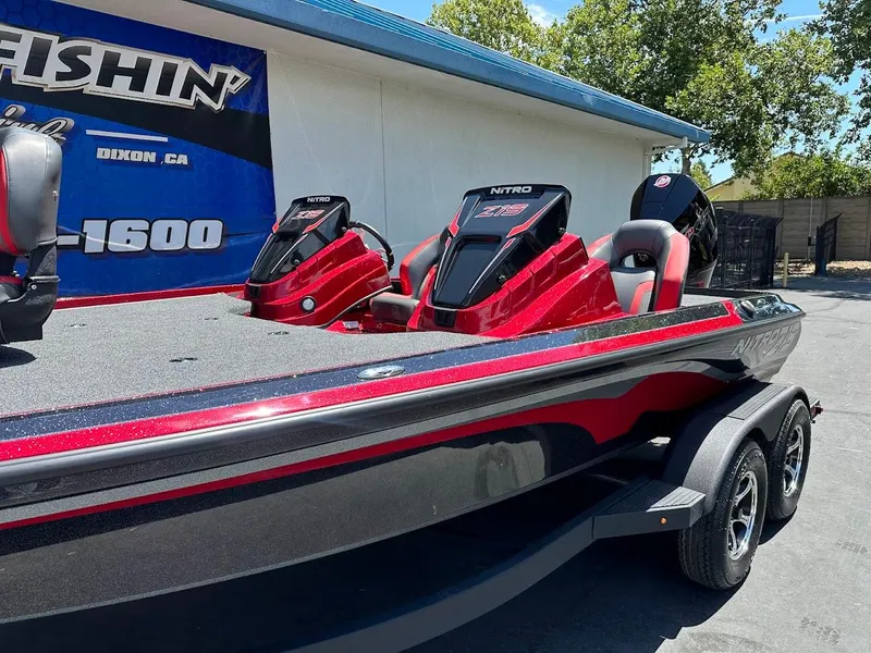 Slide: The Image of 2025 Nitro Z19 Pro boat with dual engines, parked outdoors under clear skies. - 5