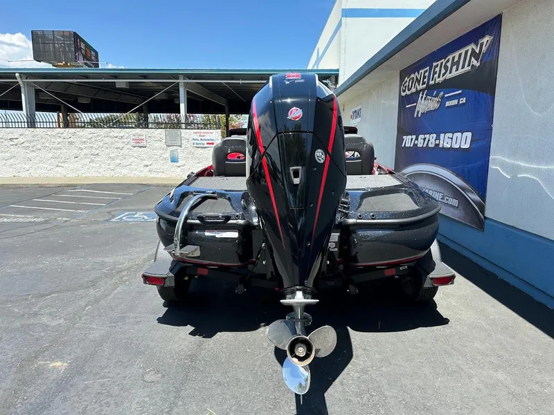 Slide: The Image of 2025 Nitro Z19 Pro boat with powerful outboard motor in parking lot. - 8