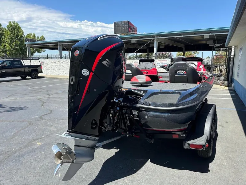 Slide: The Image of 2025 Nitro Z19 Pro boat with powerful outboard motor in a parking lot. - 9