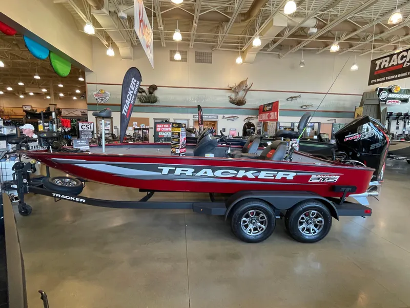 The Image of 2025 Tracker Savage 215 boat displayed in showroom, featuring sleek design and modern features. - 0