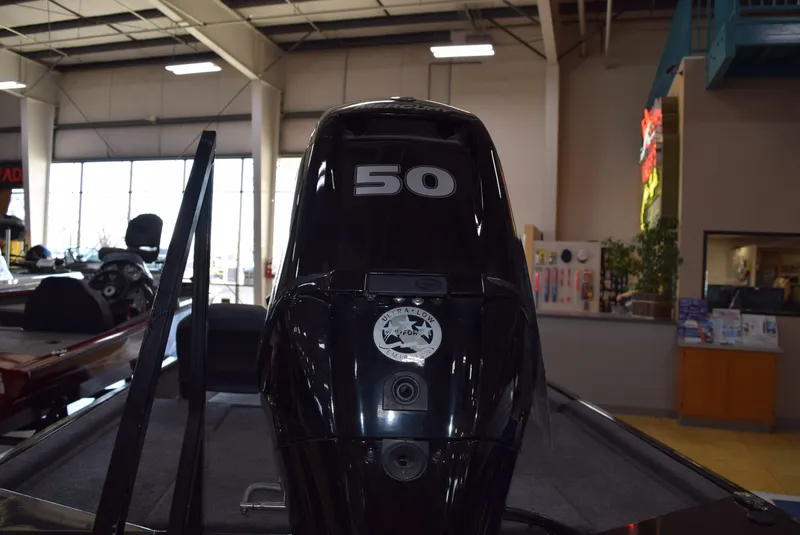 Slide: The Image of 2025 Tracker Bass Tracker Classic XL boat engine in showroom. - 6