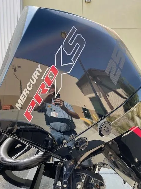 Slide: The Image of 2024 Nitro Z20 boat with Mercury Pro XS engine, reflecting surroundings. - 6