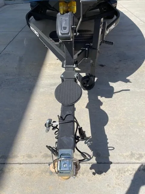 Slide: The Image of Trailer hitch of a 2024 Nitro Z20 boat on concrete surface. - 8
