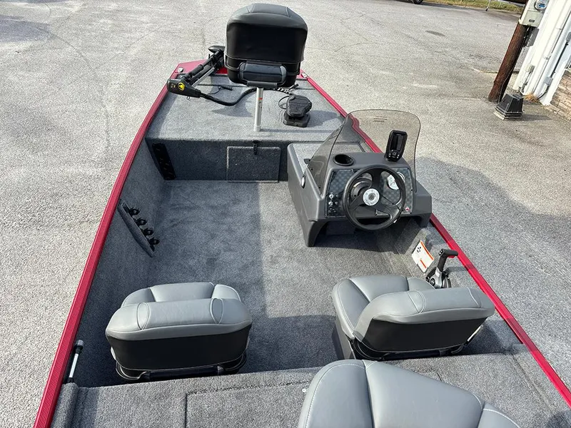 Slide: The Image of 2025 Tracker Bass Tracker Classic XL boat interior with steering console and seating. - 10