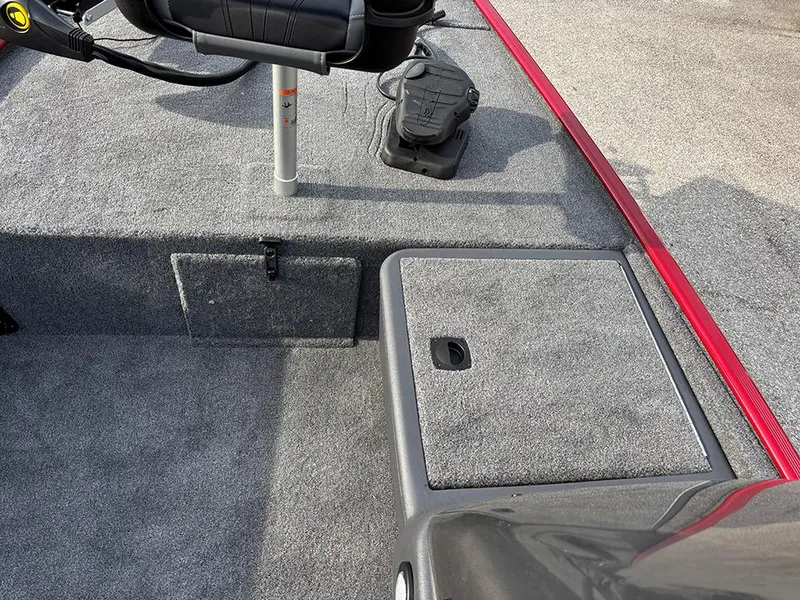 Slide: The Image of 2025 Tracker Bass Tracker Classic XL boat interior with carpeted deck and storage compartments. - 13