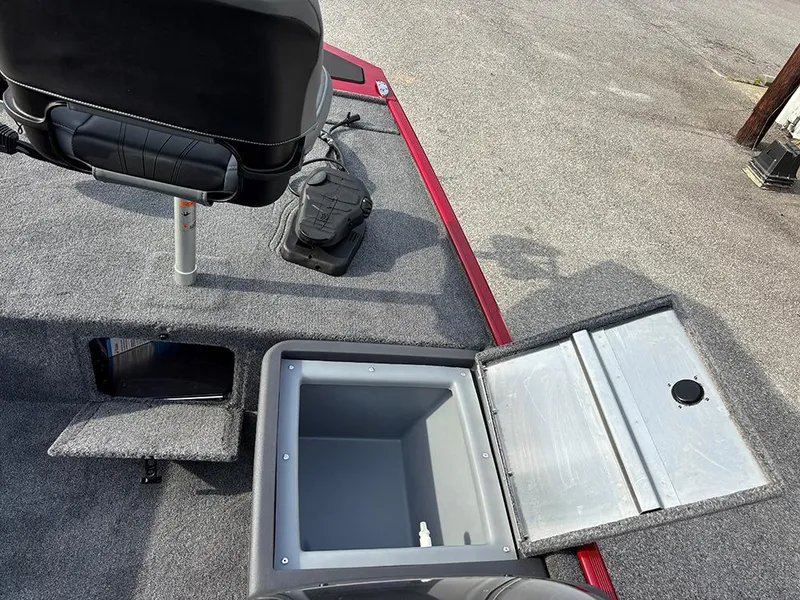 Slide: The Image of 2025 Tracker Bass Tracker Classic XL boat interior with storage compartments and seating. - 14