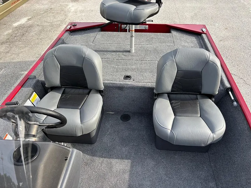 Slide: The Image of 2025 Tracker Bass Tracker Classic XL boat interior with gray seating and steering wheel. - 15