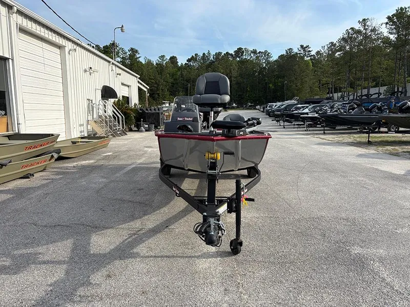 Slide: The Image of 2025 Tracker Bass Tracker Classic XL boat parked outdoors at a dealership. - 4