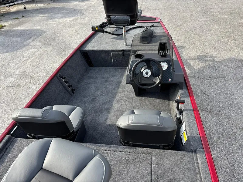 Slide: The Image of 2025 Tracker Bass Tracker Classic XL boat interior with steering console and seating. - 9