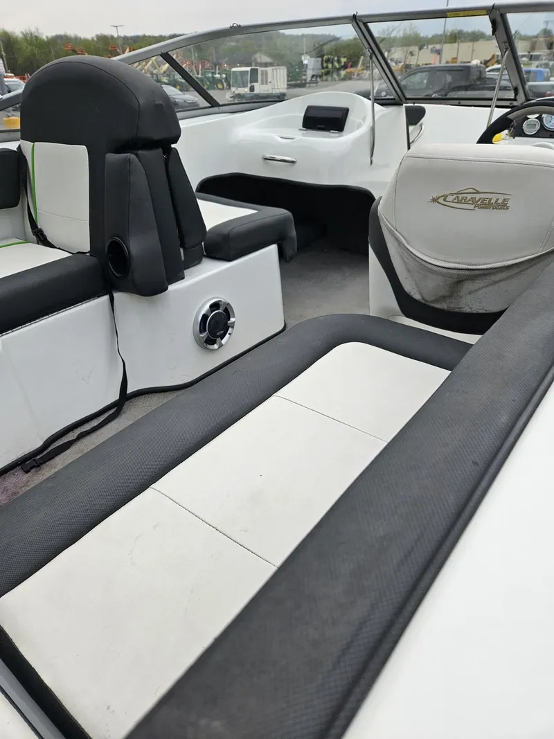 Slide: The Image of 2015 Caravelle 19EBo boat interior with white and black seating. - 8
