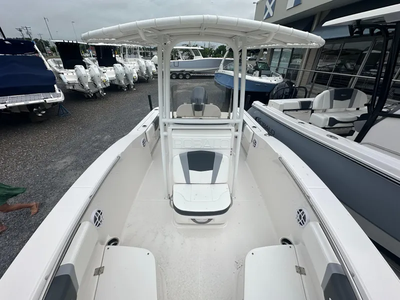 Slide: The Image of 2023 Robalo R200 Center Console boat displayed at a dealership. - 11