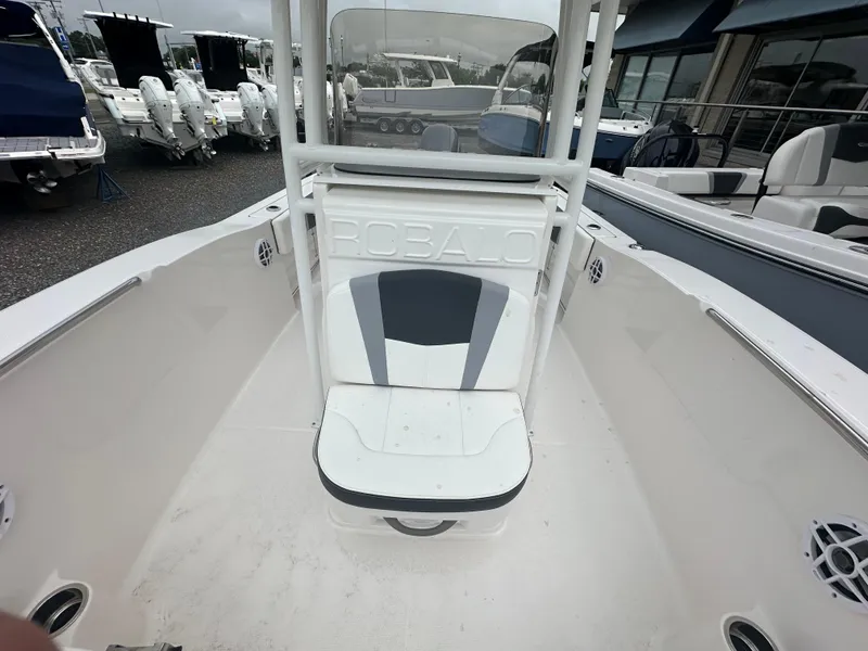 Slide: The Image of 2023 Robalo R200 Center Console boat interior with seating and console view. - 14