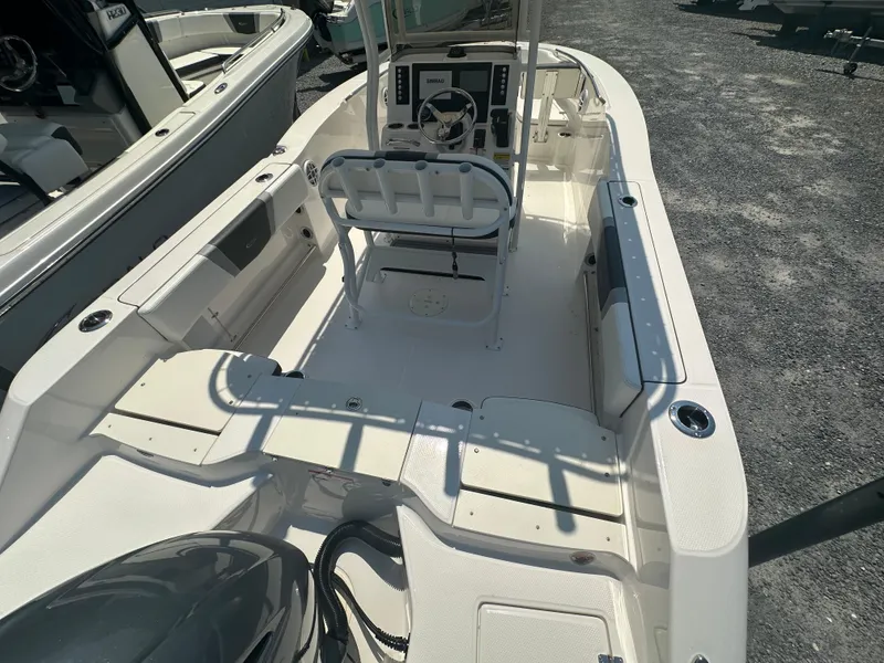 Slide: The Image of 2023 Robalo R200 Center Console boat interior with steering console and seating. - 20