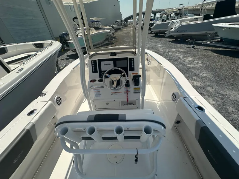 Slide: The Image of 2023 Robalo R200 Center Console boat interior with steering wheel and control panel. - 21