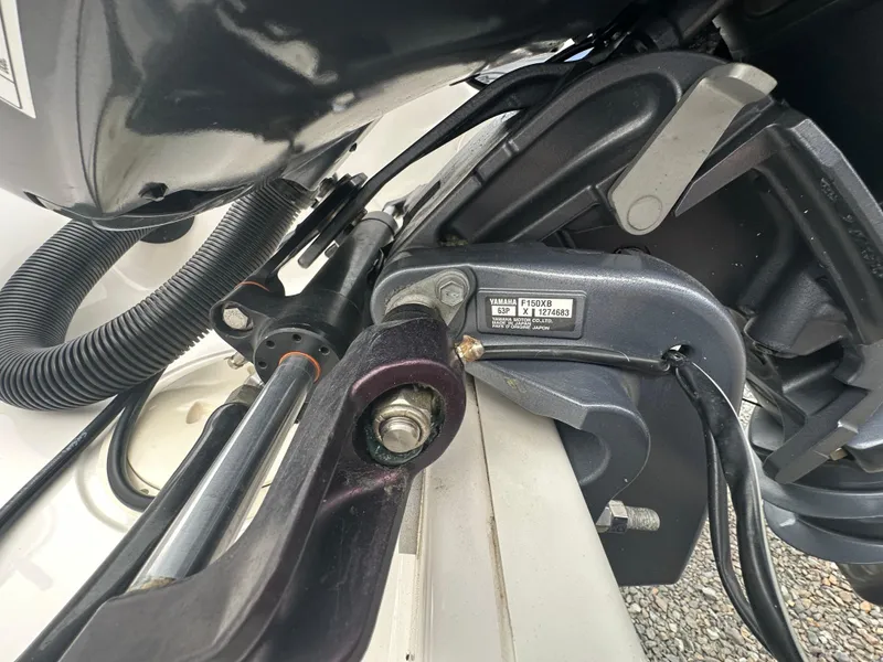 Slide: The Image of 2023 Robalo R200 Center Console boat engine close-up with Yamaha F150XB motor. - 27