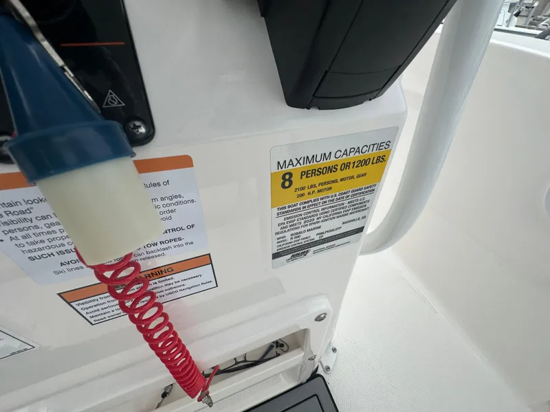 Slide: The Image of 2023 Robalo R200 Center Console capacity label, maximum 8 persons or 1200 lbs. - 3