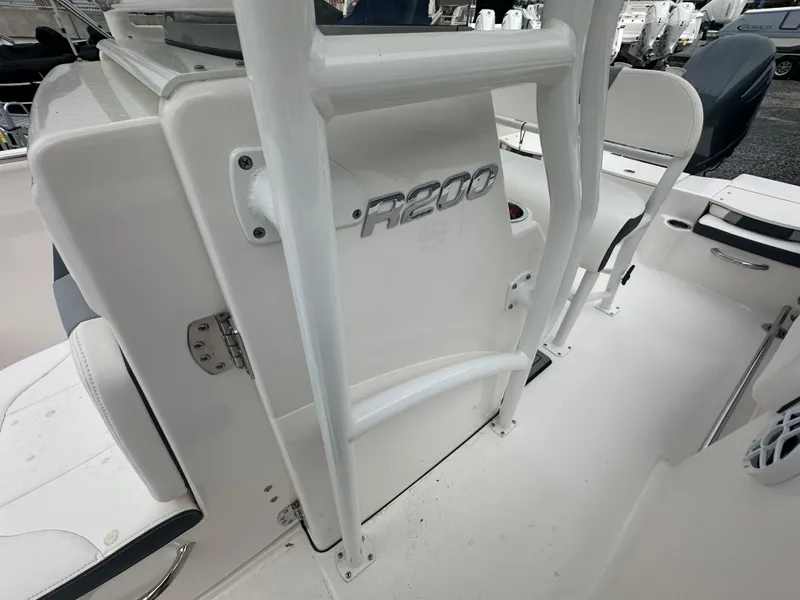 Slide: The Image of 2023 Robalo R200 Center Console boat interior with seating and console details. - 6