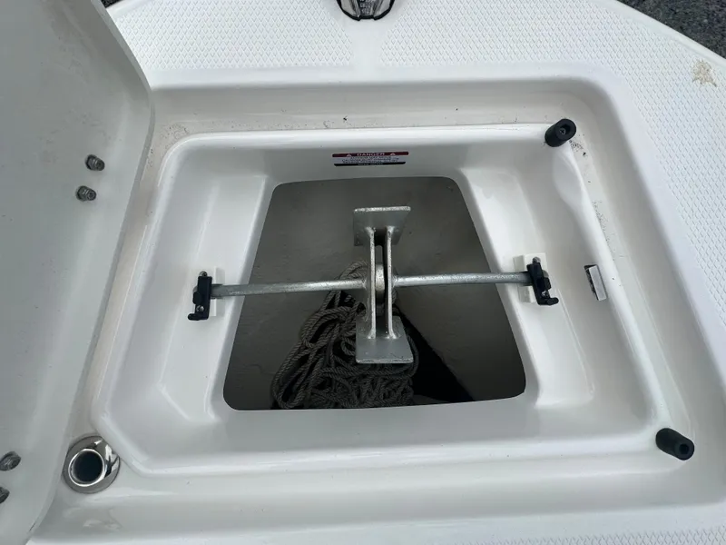 Slide: The Image of Anchor storage compartment of 2023 Robalo R200 Center Console boat. - 9