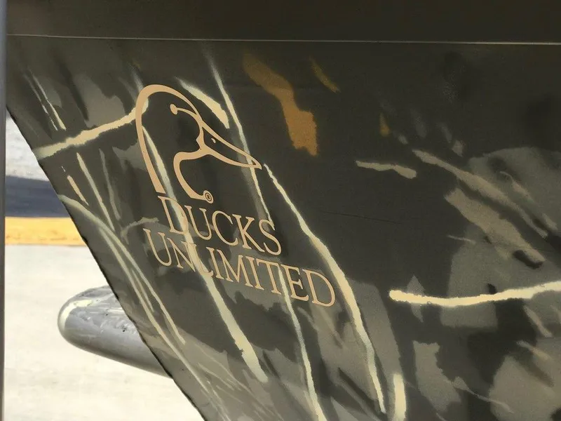 Slide: The Image of War Eagle Blackhawk 961 boat with Ducks Unlimited logo, 2025 model. - 14