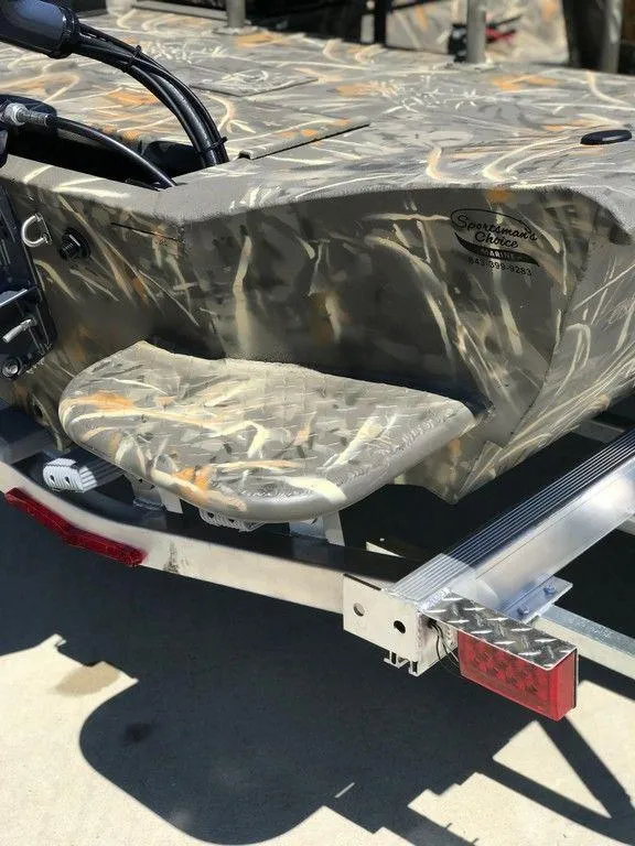 Slide: The Image of 2025 War Eagle Blackhawk 961 boat with camouflage design on a trailer. - 15