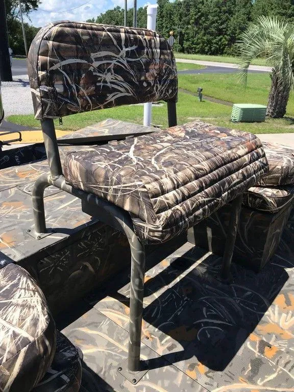 Slide: The Image of 2025 War Eagle Blackhawk 961 boat seat with camouflage design, outdoors setting. - 3