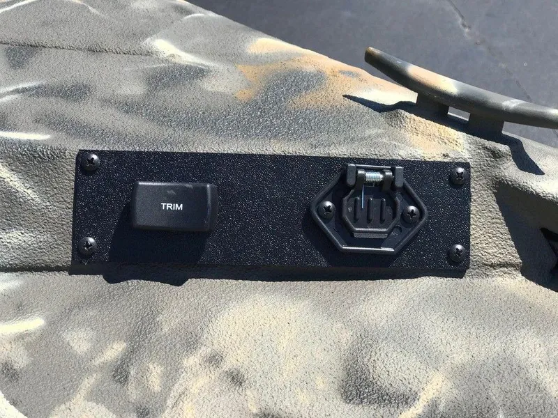 Slide: The Image of Control panel on War Eagle Blackhawk 961 boat, featuring trim switch, 2025 model. - 9