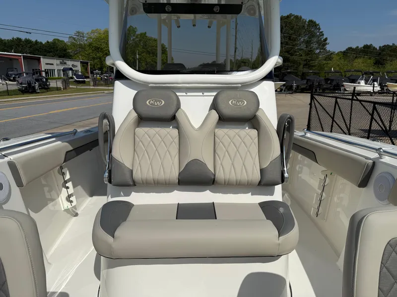 Slide: The Image of 2025 Key West 260 CC boat interior with cushioned seating and modern design. - 14