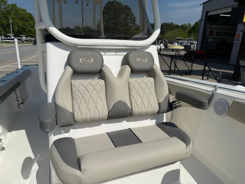 Slide: The Image of 2025 Key West 260 CC boat seats with gray and white upholstery, showcasing modern design. - 15