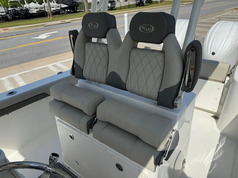 Slide: The Image of 2025 Key West 260 CC boat seats with gray upholstery and diamond stitching. - 24