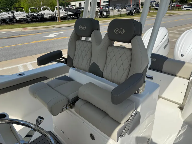 Slide: The Image of 2025 Key West 260 CC boat with luxurious dual captain's seats and modern design. - 25