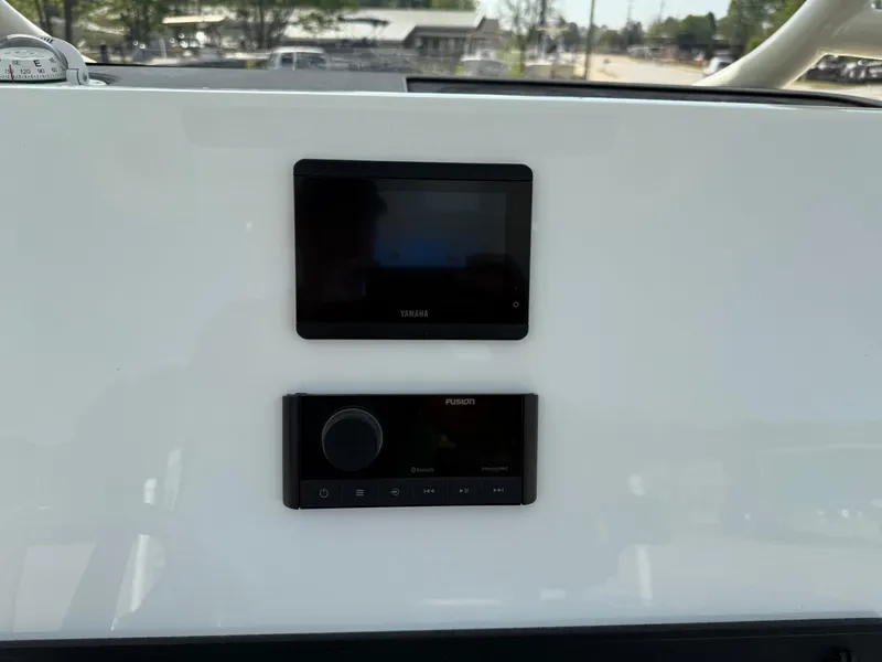 Slide: The Image of Control panel of 2025 Key West 260 CC boat with Yamaha and Fusion displays. - 27